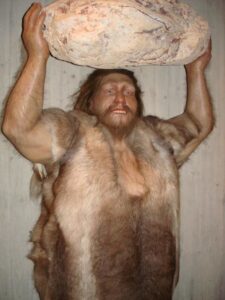 Neanderthal holding rock over his head