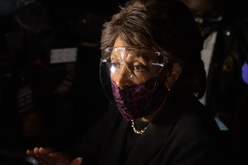 Maxine Waters wearing plastic Glasses and Facemask