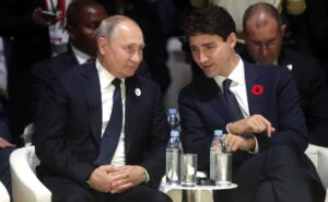 Putin and Trudeau having close discussion.