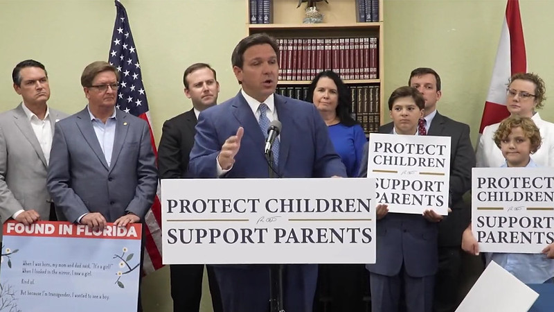 Ron DeSantis with Protect Children Support Parent Sign