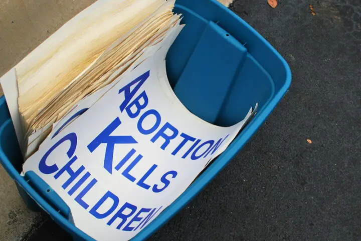 Abortion Kills Children Sign in Trash