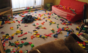 popped balloons all over a room