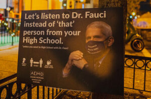 "Listen to Fauci" (CC BY 2.0) by Mike J Maguire
